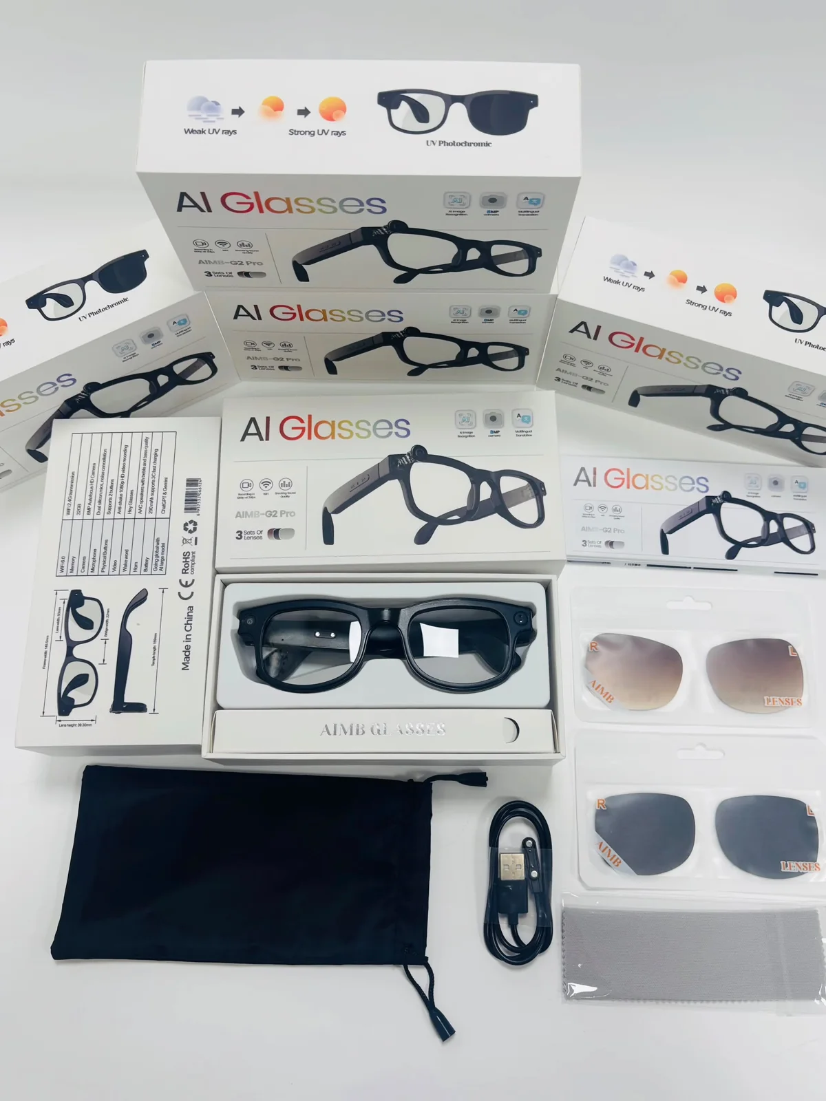 Magira Glasses package with clear, photochromic and dark lens sets, charging cable and pouch