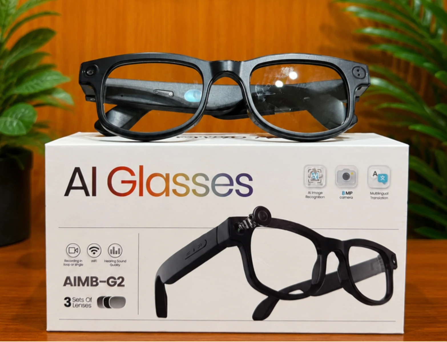 Black Magira Glasses resting on their retail box